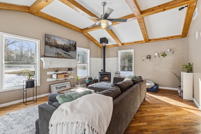 4643 Waldon Rd, Clarkston, MI 48348 - living room featuring a wood stove, a ceiling fan, wood finished floors, and coffered ceiling