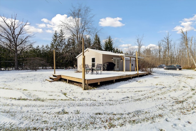 4643 Waldon Rd, Clarkston, MI 48348 - snow covered house featuring a wooden deck