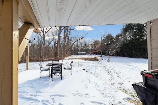 4643 Waldon Rd, Clarkston, MI 48348 - yard layered in snow featuring a patio area and view of scattered trees