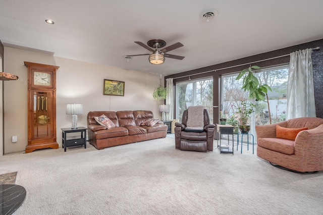 living room featuring ceiling fan and carpet floors