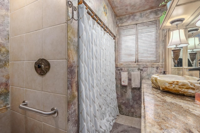 bathroom with walk in shower and tile walls