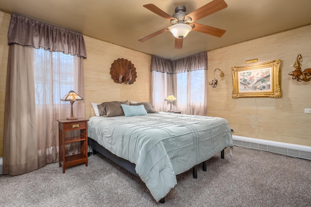 carpeted bedroom with ceiling fan and multiple windows