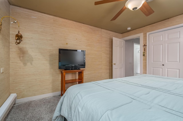 carpeted bedroom featuring ceiling fan and a closet