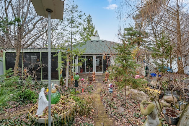 rear view of house with a sunroom