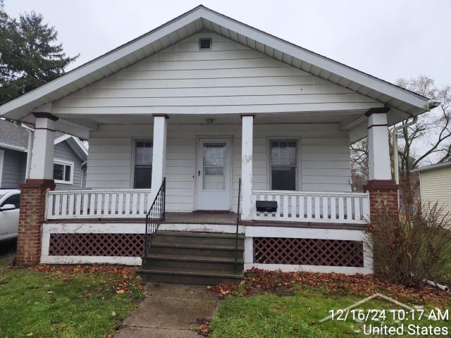 bungalow-style home featuring covered porch