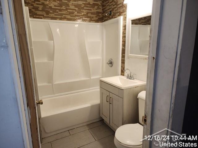 full bathroom featuring tile patterned floors, vanity, bathtub / shower combination, and toilet