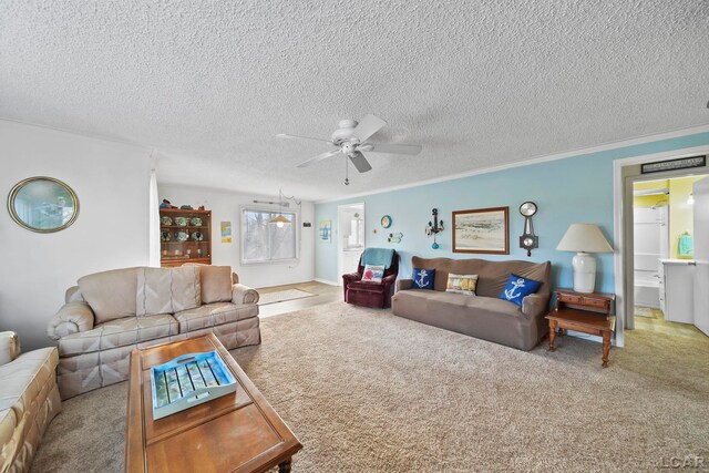 carpeted living room with a textured ceiling, ceiling fan, and ornamental molding