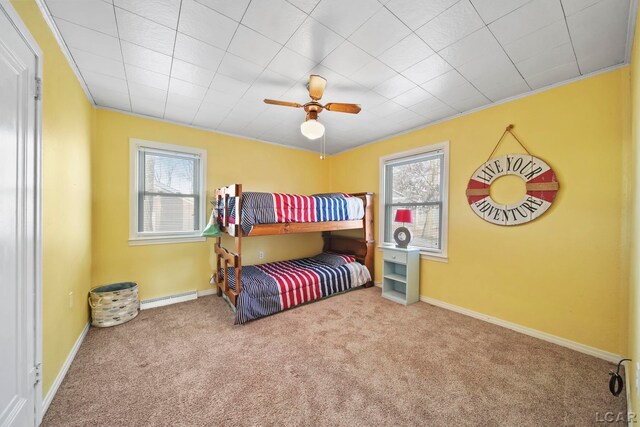 bedroom featuring carpet floors, multiple windows, and ceiling fan