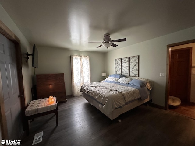 bedroom with ceiling fan and dark hardwood / wood-style flooring