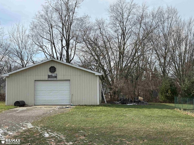 garage featuring a yard