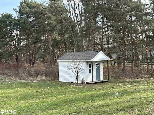 view of outbuilding with a lawn