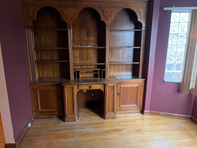 unfurnished office with light wood-type flooring