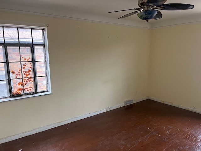 unfurnished room featuring ceiling fan and dark hardwood / wood-style floors