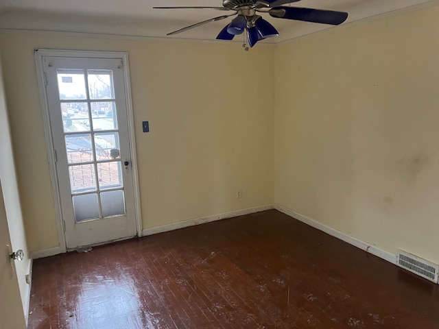 spare room featuring dark hardwood / wood-style floors and ceiling fan