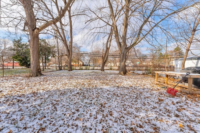 view of yard layered in snow