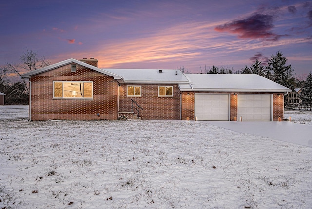 ranch-style house featuring a garage