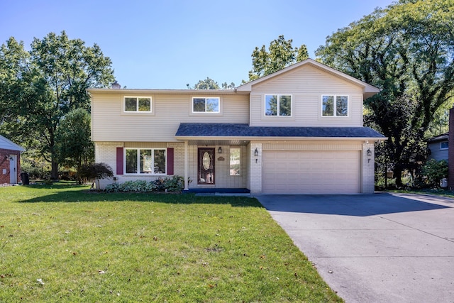 front facade featuring a front lawn and a garage