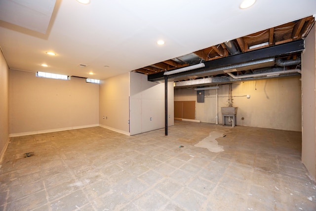 basement with sink and electric panel