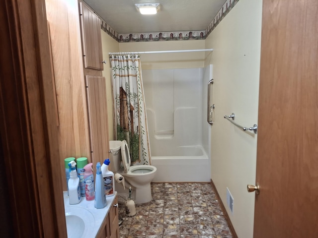 full bathroom featuring shower / bath combo, vanity, and toilet