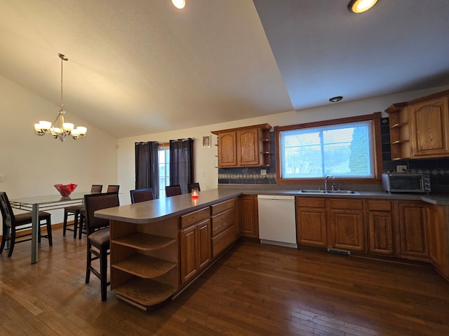 kitchen with dishwasher, vaulted ceiling, dark hardwood / wood-style floors, and an inviting chandelier