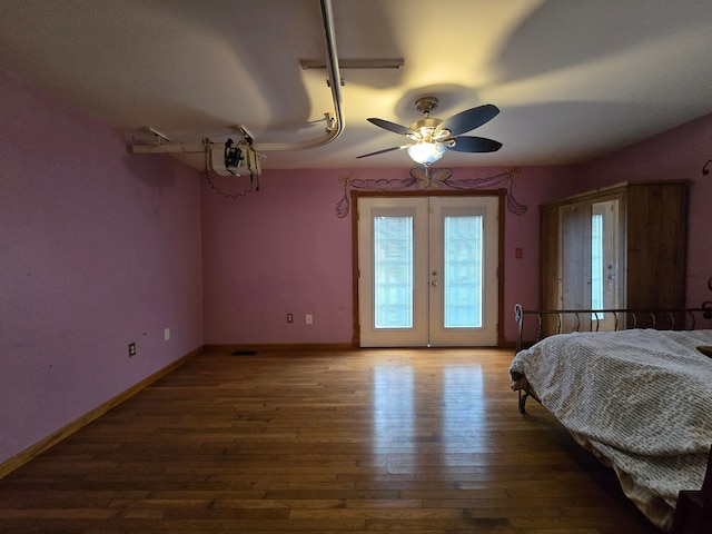 bedroom featuring access to outside, ceiling fan, french doors, and wood-type flooring