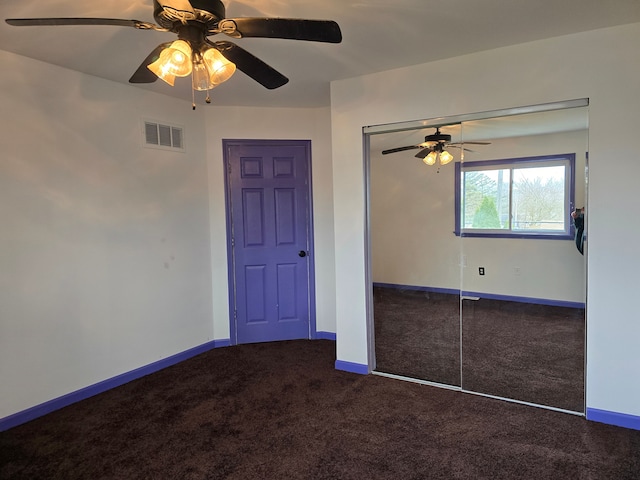 unfurnished bedroom featuring carpet flooring, ceiling fan, and a closet