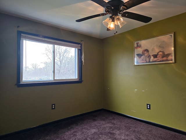 empty room featuring carpet flooring and ceiling fan