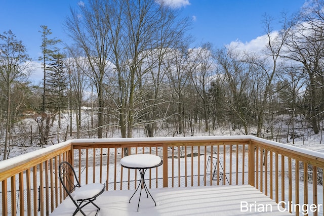 view of snow covered deck