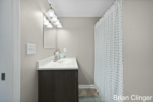 bathroom with vanity and wood-type flooring