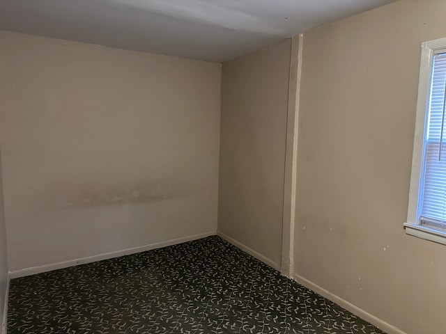 empty room with carpet flooring