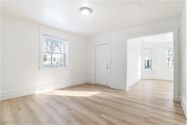 spare room featuring light wood-type flooring