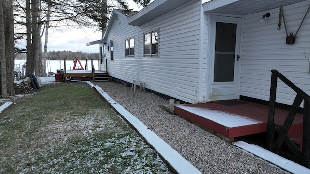 snow covered property featuring a deck