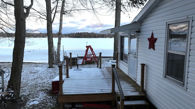 view of dock featuring a deck with water view