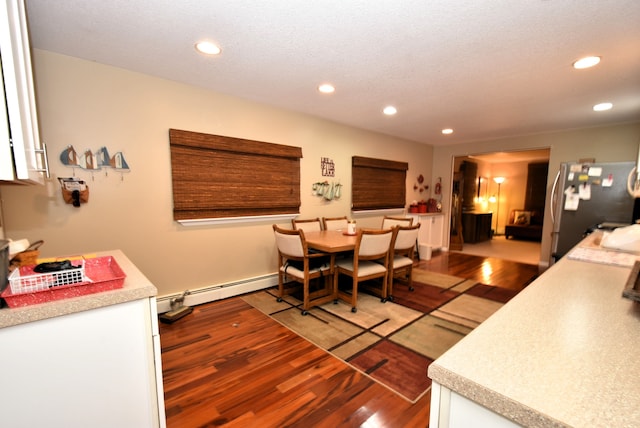 4141 Buena Vista Dr, Greenbush, MI 48738 - dining room featuring recessed lighting, wood finished floors, and baseboard heating
