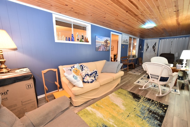 living room with wood ceiling, wood-type flooring, and wooden walls