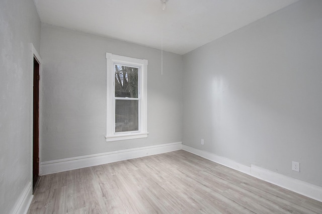 596 Superior St, Benton Harbor, MI 49022 - empty room featuring light wood finished floors and baseboards