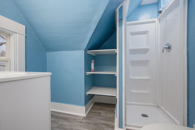 596 Superior St, Benton Harbor, MI 49022 - spacious closet with vaulted ceiling and wood finished floors