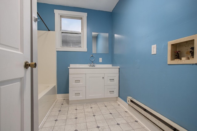 596 Superior St, Benton Harbor, MI 49022 - bathroom with vanity, baseboard heating, washtub / shower combination, and tile patterned flooring