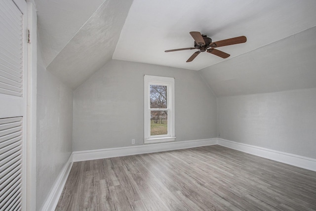 596 Superior St, Benton Harbor, MI 49022 - additional living space with wood finished floors, vaulted ceiling, and ceiling fan