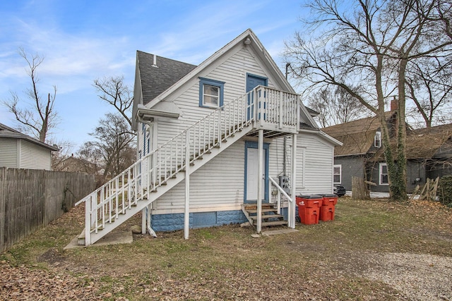 596 Superior St, Benton Harbor, MI 49022 - back of property featuring entry steps, stairs, and roof with shingles