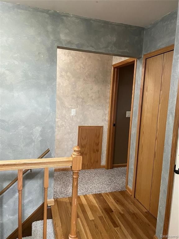 staircase featuring hardwood / wood-style floors