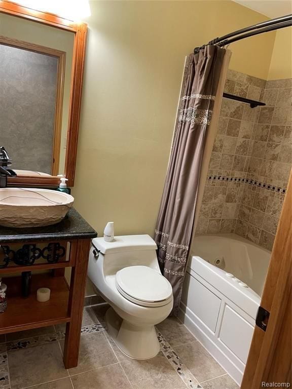 full bathroom with toilet, tile patterned floors, vanity, and shower / tub combo with curtain