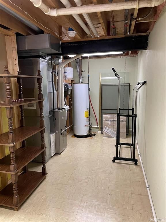 basement featuring gas water heater