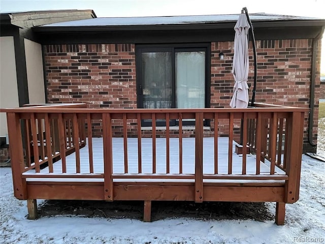 view of snow covered deck