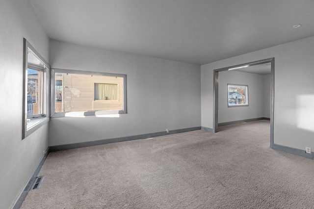 empty room featuring carpet flooring