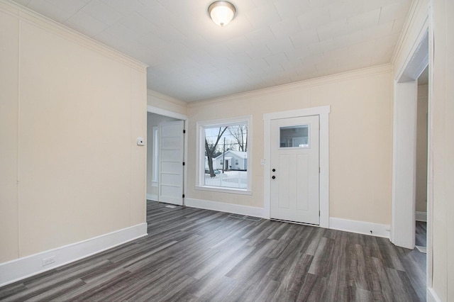 foyer entrance with dark hardwood / wood-style floors and crown molding