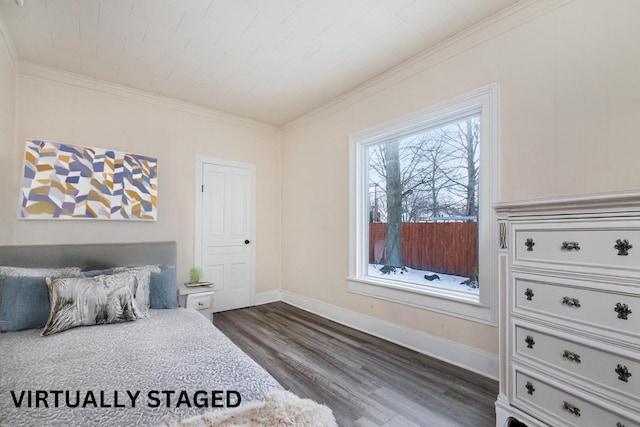 bedroom with dark hardwood / wood-style floors and ornamental molding