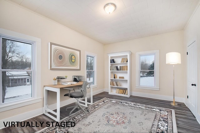 office space with plenty of natural light and dark hardwood / wood-style flooring