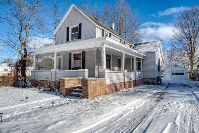 view of front of home with an outdoor structure and a garage