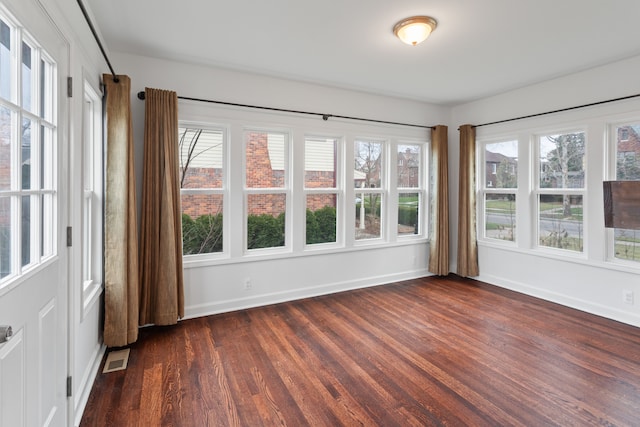 unfurnished sunroom featuring a wealth of natural light